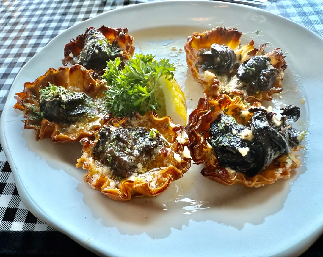 Elegant Italian dish with roast beef, mushrooms, and grilled lettuce. Styled with fresh herbs and vibrant vegetables.